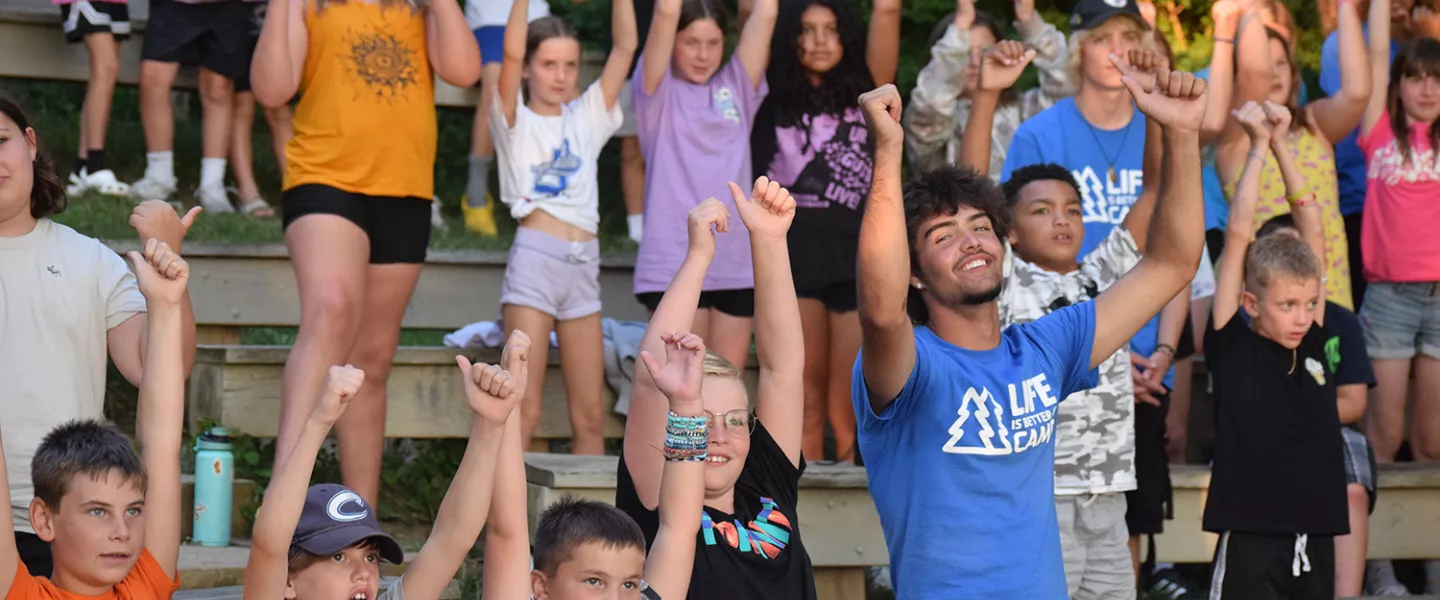 campers and staff cheering